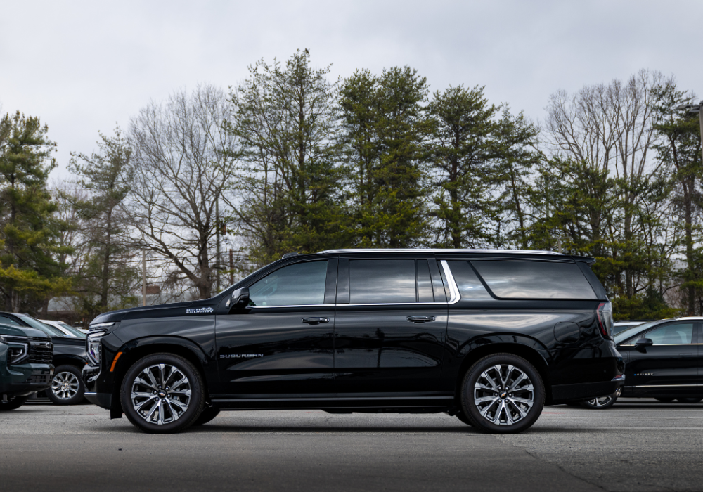 Driver's side exterior view of a black 2026 Chevrolet Tahoe parked in a dealership lot