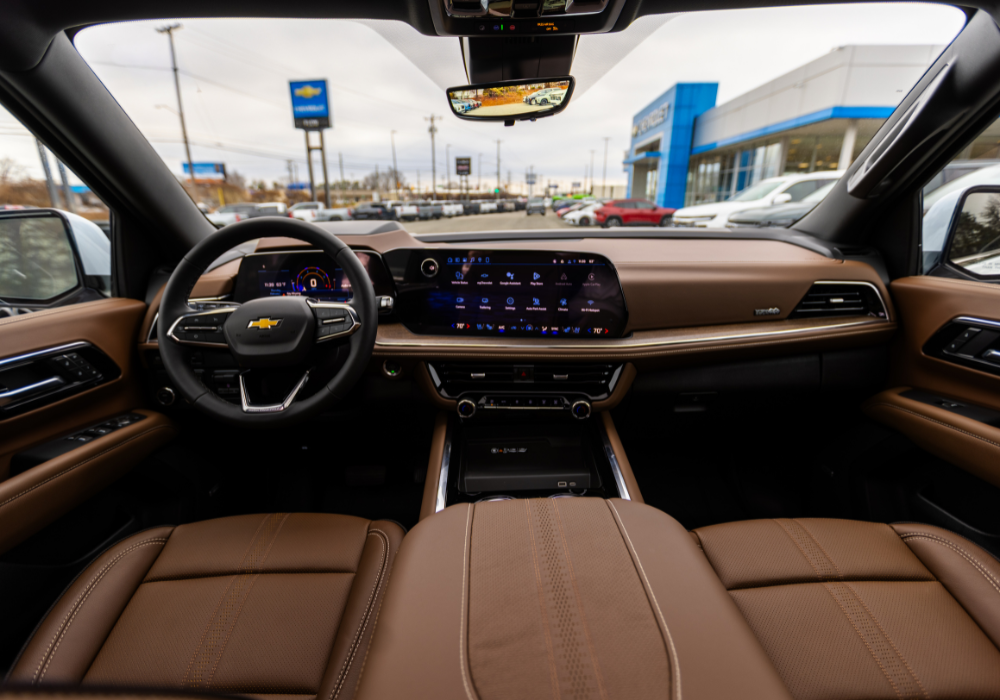 Chevy Tahoe interior technology and seating view. The seats are made of brown leather