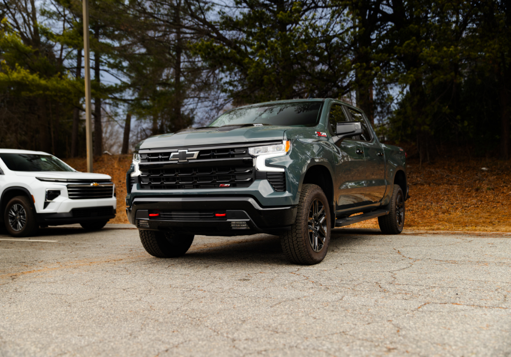 New Chevy Silverado 1500 parked with trees in the background